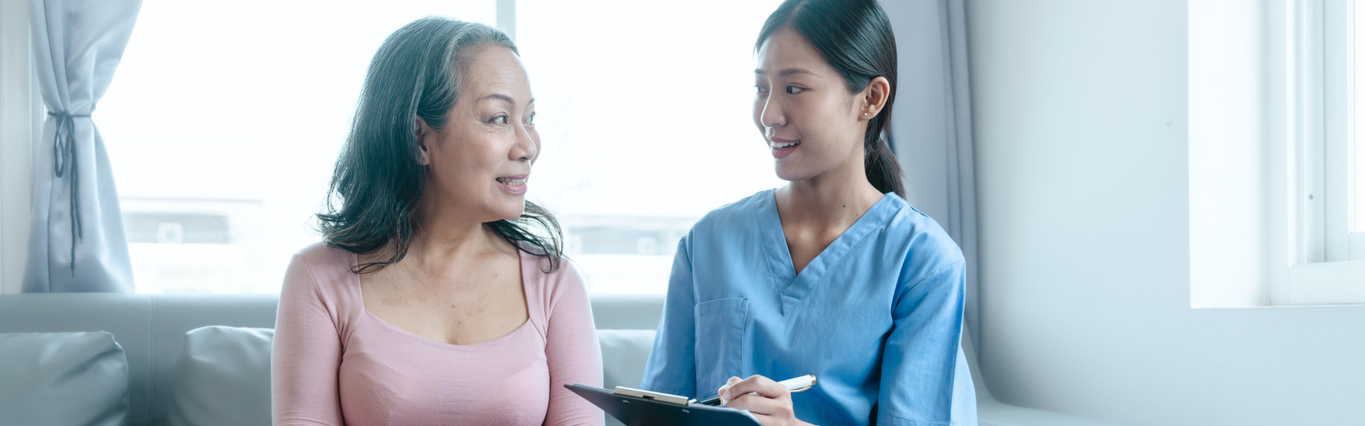 Caregiver talking to elderly