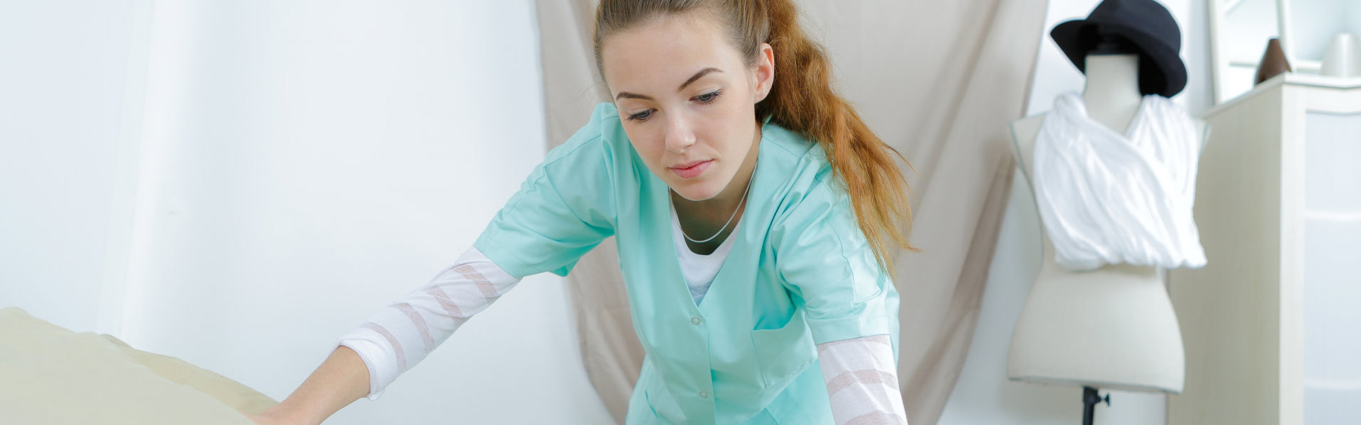 Caregiver fixing bed