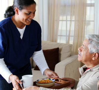 Home health care worker and an elderly couple