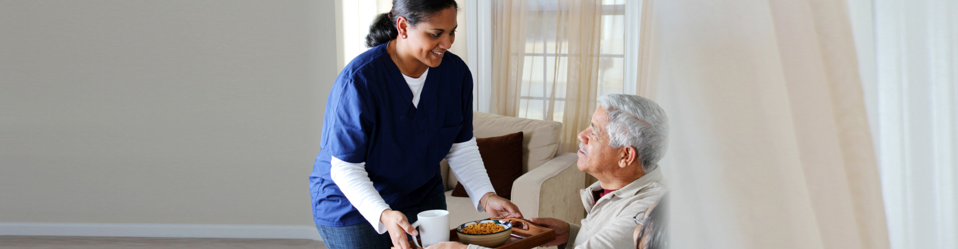 Home health care worker and an elderly couple